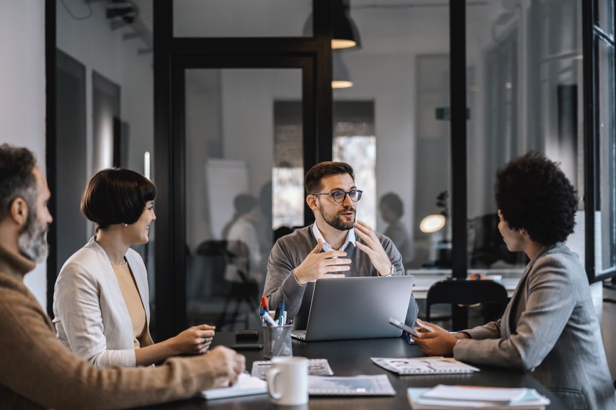 Leadership team discussing financial dashboard